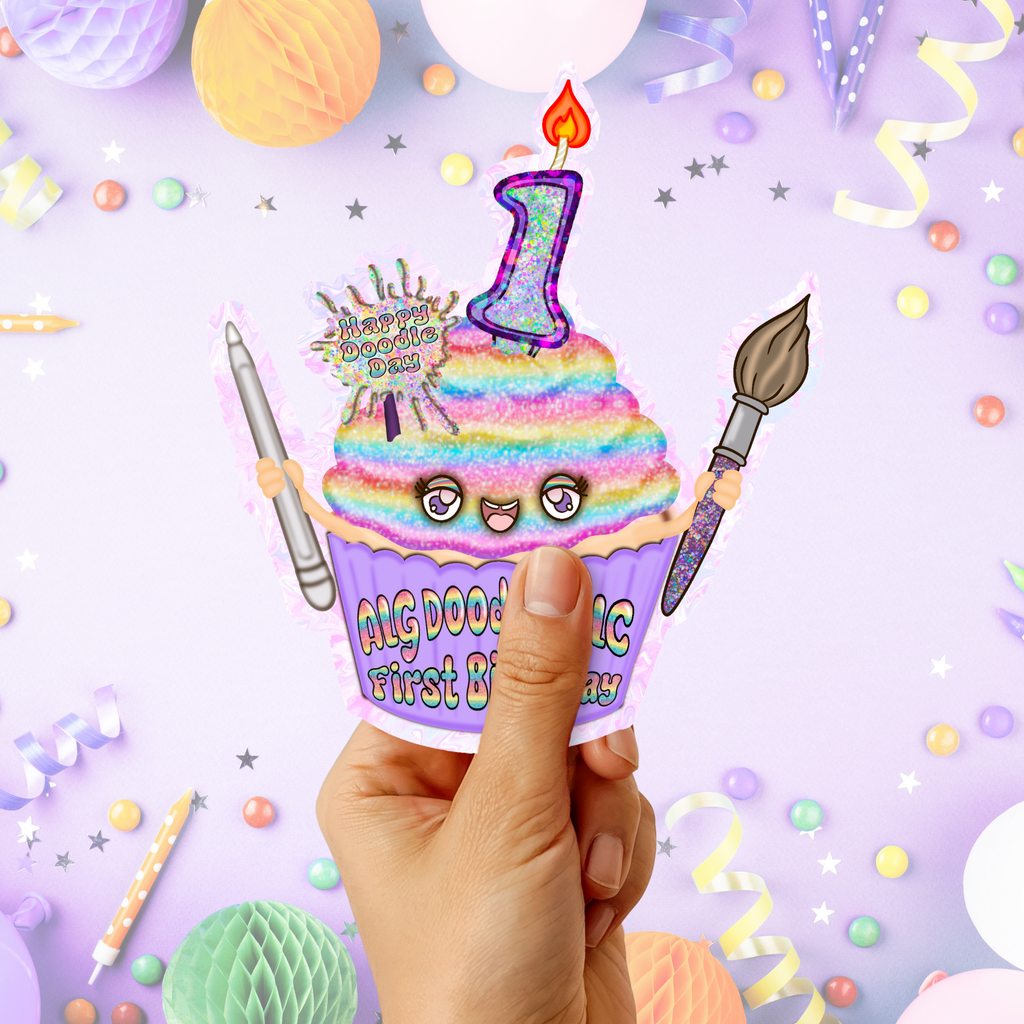Hand holding a rainbow cupcake “ALG Doodles LLC First Birthday” sticker in a pastel birthday party themed background.