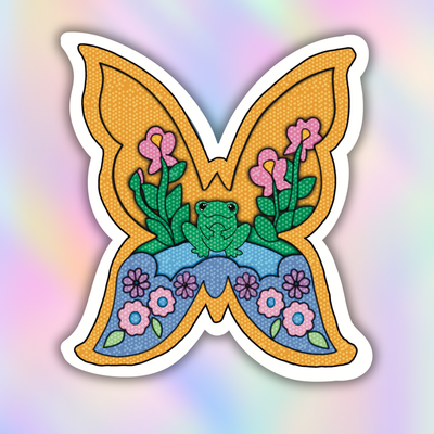 A butterfly-shaped patch or sticker featuring a colorful illustrated design with a green frog, pink flowers, blue and yellow sections, and a white border, shown against a soft pastel rainbow gradient background.