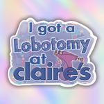 A die-cut sticker featuring the text 'I got a lobotomy at claire's' in blue glitter-style lettering, with a purple cartoon figure and a light purple patterned background, shown on a pastel rainbow gradient backdrop.