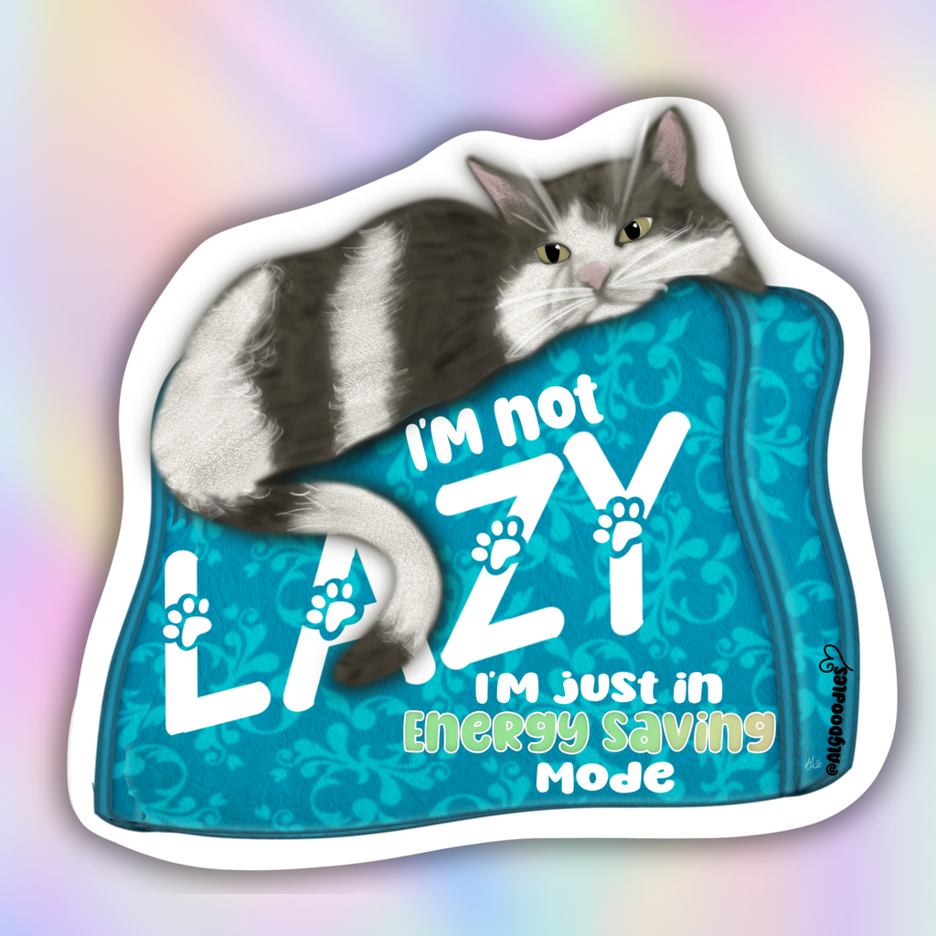 A die-cut sticker featuring a gray and white cat lounging on a teal patterned cushion with the text 'I'm not LAZY I'm just in Energy Saving Mode'. The sticker is shown against a pastel rainbow gradient background.