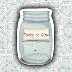 A die-cut sticker featuring a light blue mason jar with spiderwebs, a cream label reading 'Fucks to Give', and a small black spider, shown against a background of repeated matching jar illustrations.