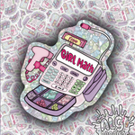 A die-cut sticker featuring a retro calculator illustration with the words 'GIRL Math' on the screen, pink headphones, and a 'Free' sign, set against a patterned background of matching doodle-style newspaper pages. The brand name 'ALG doodles' is visible in the bottom right corner.