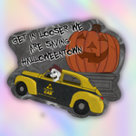 A die-cut sticker or graphic design featuring a cartoon orange jack-o'-lantern, a yellow and black cab with a skull driver and 'Halloween Town' text, and the phrase 'GET IN LOOSER WE ARE SAVING HALLOWEENTOWN' on a dark gray background, set against a pastel rainbow gradient backdrop.