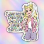 A die-cut sticker featuring a cartoon illustration of a blonde woman in a pink jacket and gray pants next to the text 'LOOK LIKE BARBIE SMOKE LIKE MARLEY' in a retro bubbly font, set against a pastel rainbow gradient background.