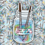 A die-cut sticker featuring an illustrated paint jar with two paintbrushes and the text 'Paint water. Do not drink.