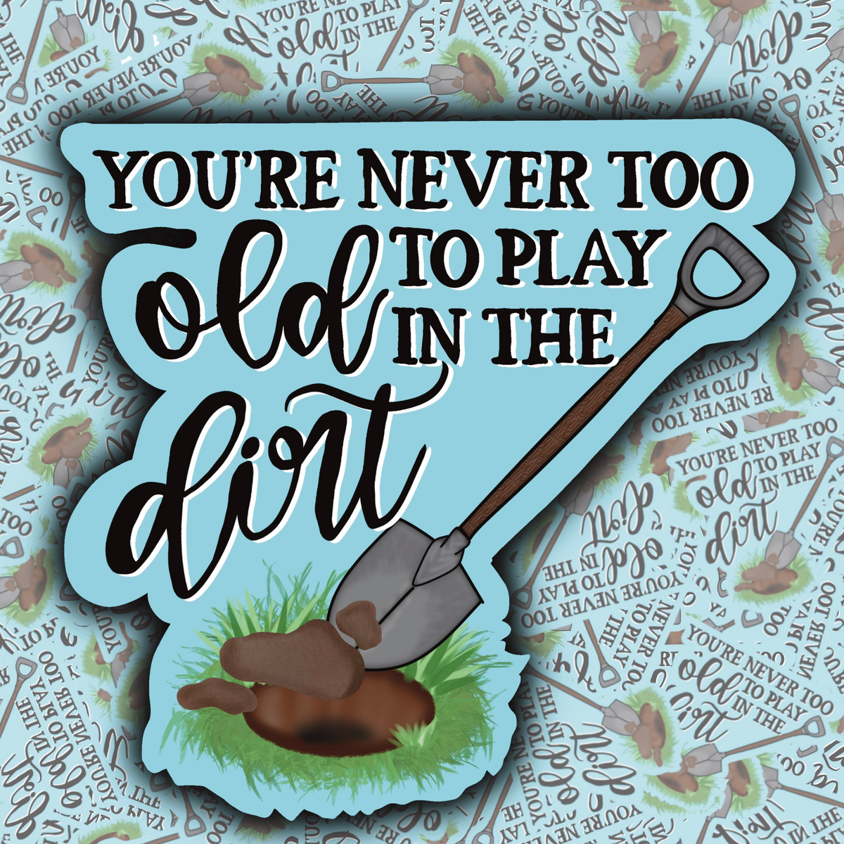 Decorative sign with a shovel and text 'You're never too old to play in the dirt' on a patterned background.