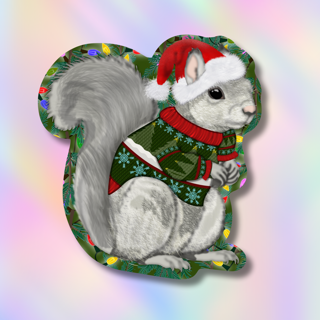 A die-cut sticker or decal featuring a gray squirrel wearing a red Santa hat and a green holiday sweater with snowflake patterns, set against a soft pastel rainbow gradient background.