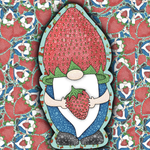 A stylized strawberry-themed gnome illustration centered over a repeating strawberry-and-leaf patterned background. The gnome has a large red strawberry-shaped hat, green leafy accents, a white beard, blue clothing, and holds a strawberry.