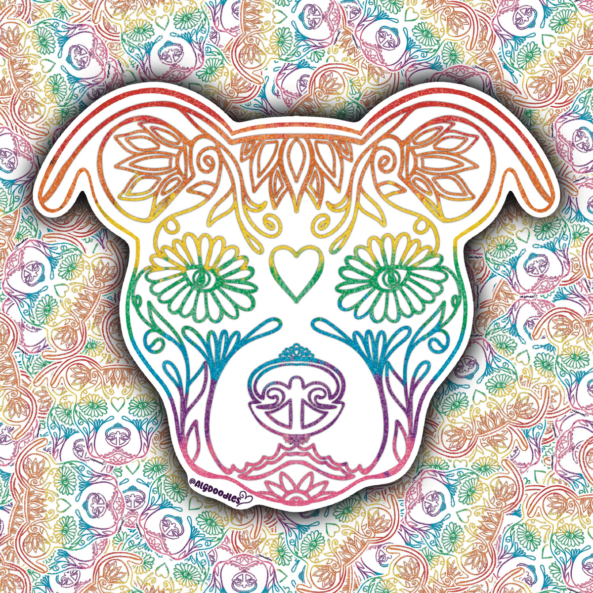 A die-cut sticker shaped like a dog head, decorated with colorful rainbow line art and floral motifs, shown against a busy multicolor patterned background.