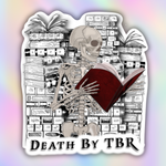 A die-cut sticker featuring a black and white illustrated skeleton reading a red book, set against a background of book stacks and plants, with the text 'DEATH BY TBR' at the bottom. The sticker is shown on a pastel iridescent gradient background.