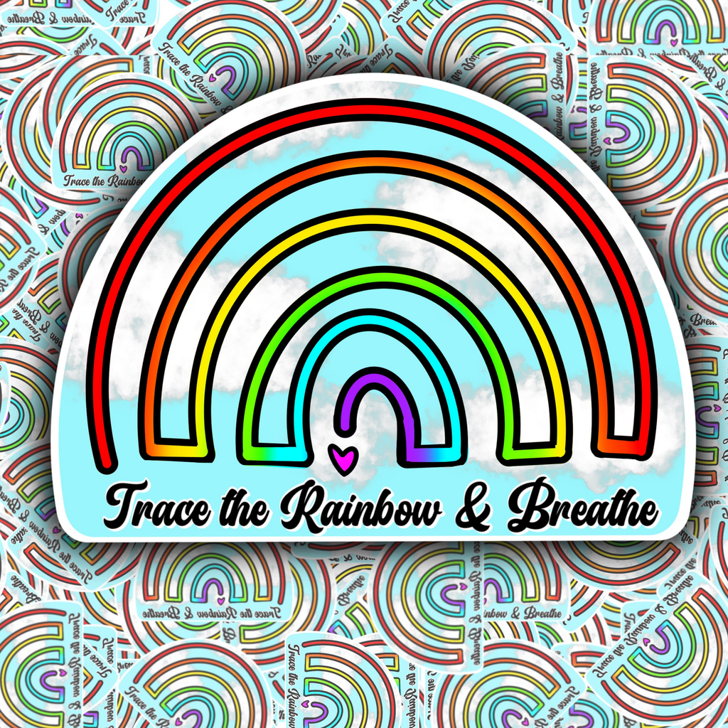 A die-cut sticker featuring a stylized rainbow with the text 'Trace the Rainbow & Breathe' and a small pink heart, shown against a patterned background of similar rainbow maze illustrations.