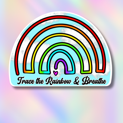 A die-cut sticker featuring a stylized rainbow with the text 'Trace the Rainbow & Breathe' on a pastel rainbow gradient background.